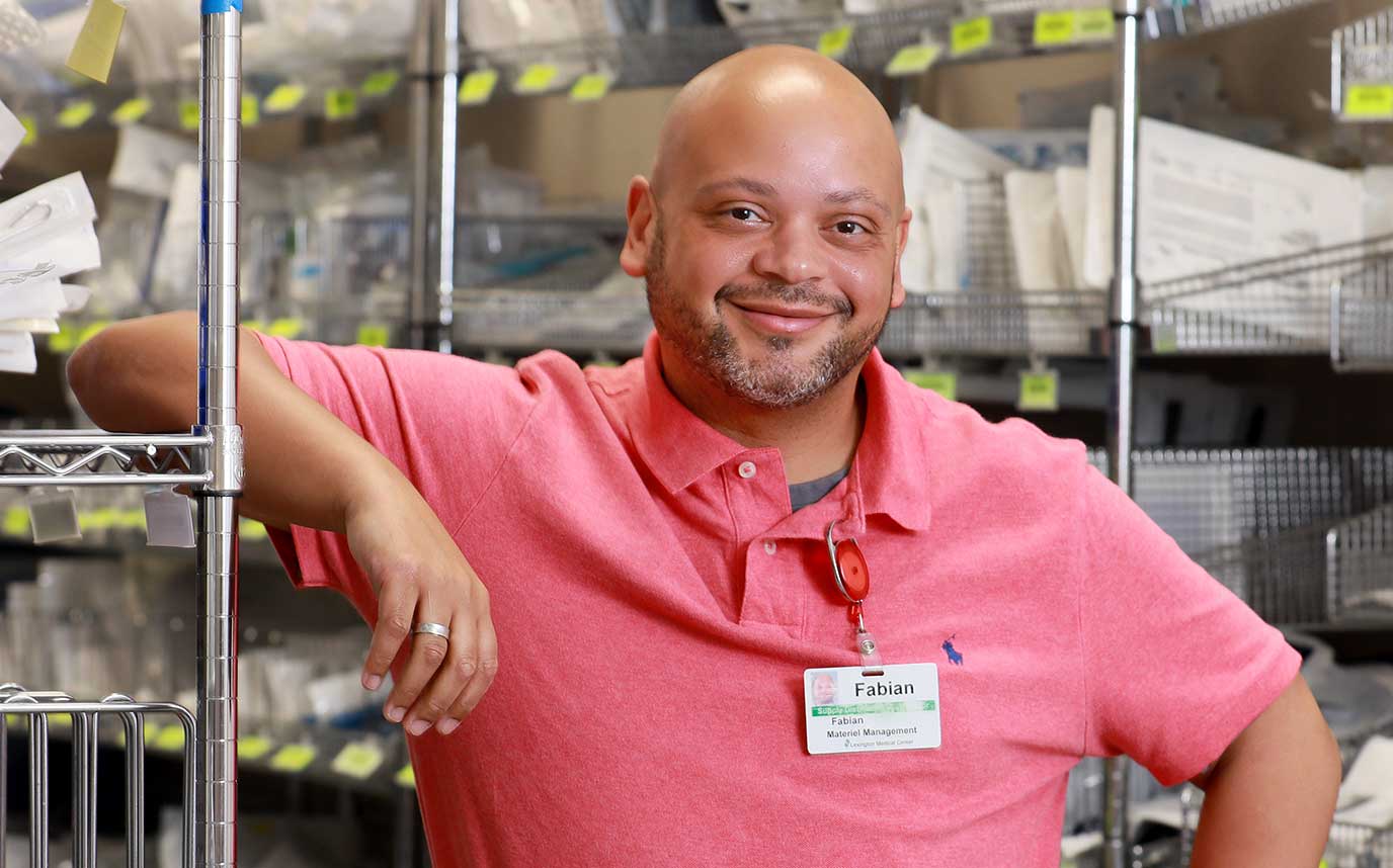 A smiling administrator wearing a Lexington Health name tag.
